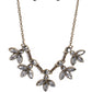 Paparazzi Accessories - Dauntlessly Debonair - Brass EMP 2023 Brass Necklaces featuring smoldering marquise style cuts, oversized smoky gems fan out from an interconnected, circular smoky rhinestone display. Separating the dauntless florals, airy brass ovals, stamped with a dot motif, create additional eye-catching sheen. Features an adjustable clasp closure.  Sold as one individual necklace. Includes one pair of matching earrings.
