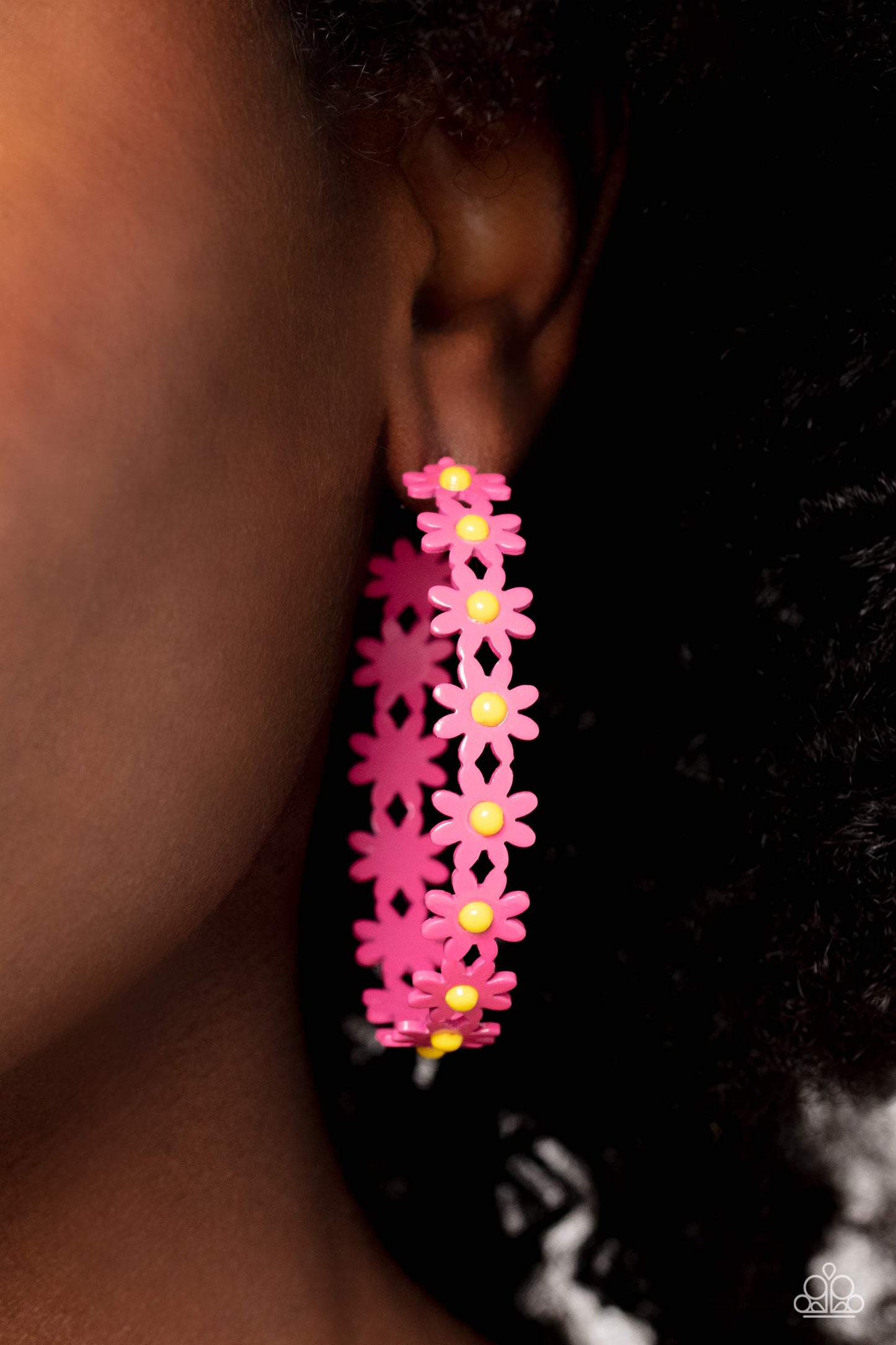 Paparazzi Accessories - Daisy Disposition - Pink Hoop Earrings a dainty collection of hot pink daisies with yellow centers blooms into a free-spirited hoop around the ear. Earring attaches to a standard post fitting. Hoop measures approximately 2" in diameter.  Sold as one pair of hoop earrings.
