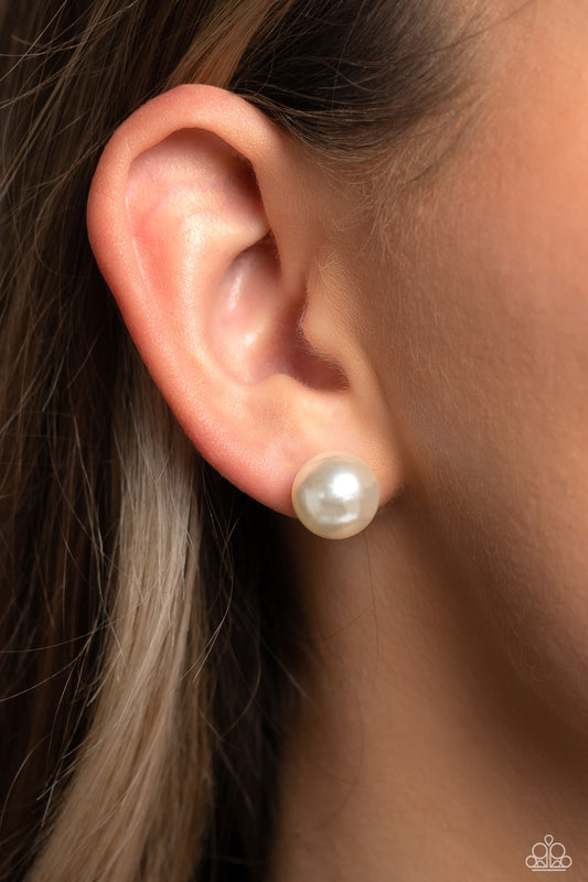 Paparazzi Accessories - Debutante Details - White Pearl Stud Earrings an oversized white pearl, stands out against the ear adding a timeless twist to a basic staple piece perfect for layering. Earring attaches to a standard post fitting.  Sold as one pair of post earrings.