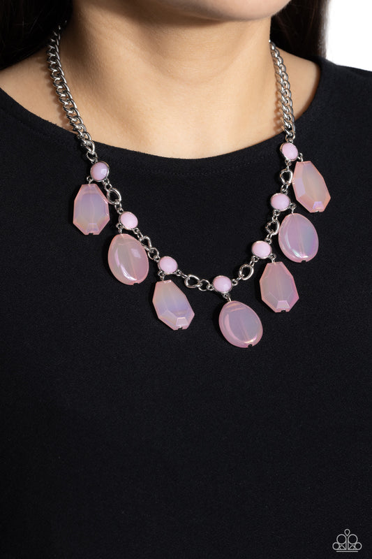 Paparazzi Accessories - Maldives Mural - Pink Necklshapea collection of chiseled, clear and milky geometric shapes in pink hues feature an iridescent overlay as they cascade from a silver curb chain, resulting in a bubbly and boisterous fringe below the collar. A layer of faceted milky pink beads are infused along the silver chain for an additional pop of color. Features an adjustable clasp closure.  Sold as one individual necklace. Includes one pair of matching earrings.