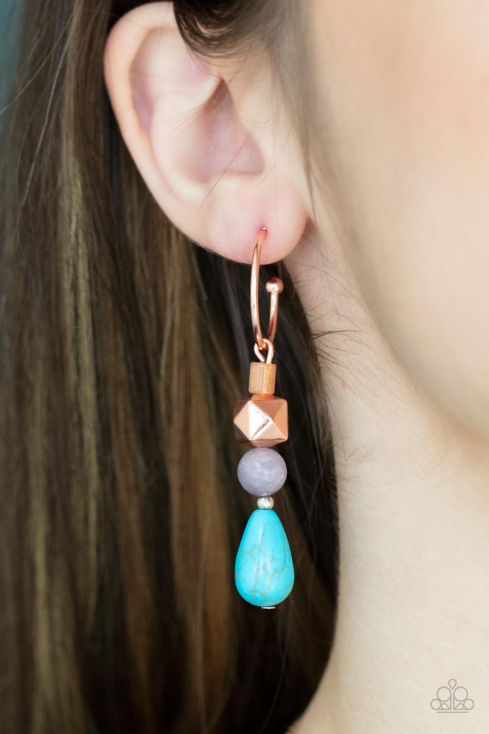 Boulevard Stroll - Copper Faceted Hoop Earrings a charismatic collection of glassy, amethyst, and turquoise stone beads, accented with a shiny copper faceted square bead, are threaded onto a pin which dangles from a dainty shiny copper hoop. Earring attaches to a standard post fitting. Hoop measures approximately 3/4" in diameter.  Sold as one pair of hoop earrings.  Paparazzi Jewelry is lead and nickel free so it's perfect for sensitive skin too!