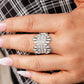 Urban Empire - White Rhinestone Life of The Party Rings staggered rows of emerald cut rhinestones flare out from the top and bottom of an explosion of classic white rhinestones, creating a smoldering statement piece atop the finger. Features a stretchy band for a flexible fit.

Sold as one individual ring.

