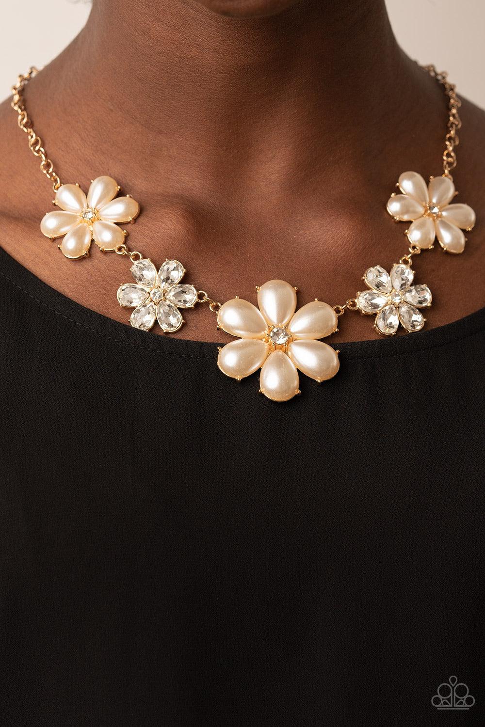 Fiercely Flowering - Gold Floral Necklaces featuring glassy white rhinestone centers, bubbly pearl petaled gold flowers gradually increase in size as they alternate with white rhinestone petaled flowers below the collar for a fierce floral fashion. Features an adjustable clasp closure.  Sold as one individual necklace. Includes one pair of matching earrings.