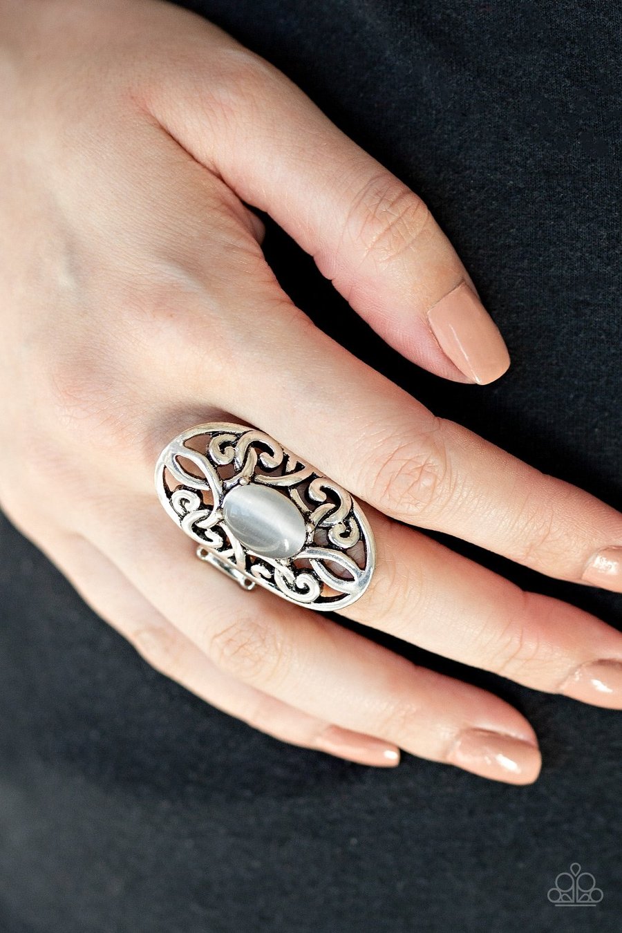 Paparazzi Accessories GLEAM Big - Silver Rings a glowing cat's eye stone is pressed into the center of an oval backdrop swirling with vine-like filigree for a whimsical look. Features a stretchy band for a flexible fit.