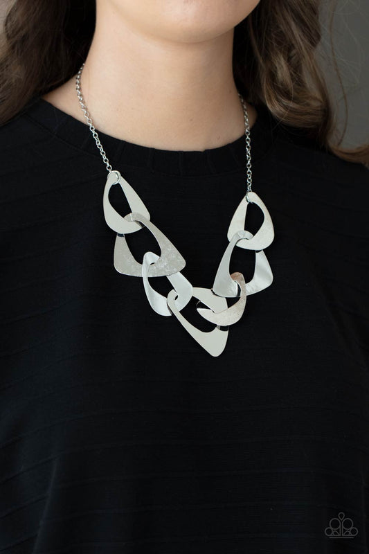 Guide to the Galaxy - Silver Triangular Necklaces - Paparazzi Accessories large triangular cutouts stamped in a lightly dotted texture link below the collar forming a dramatic display of silver slices. Features an adjustable clasp closure.  Sold as one individual necklace. Includes one pair of matching earrings.