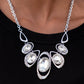 Paparazzi Hypnotic Twinkle - White April 2022 Life of the Party Necklaces dusted in sections of glassy white rhinestones, asymmetrical silver frames curl around oversized white gems below the collar. Varying in shape, the mismatched frames increase in size as they near the center for a hypnotizing finish. Features an adjustable clasp closure.  Sold as one individual necklace. Includes one pair of matching earrings.  Life of the Party exclusive item April 2022.  
