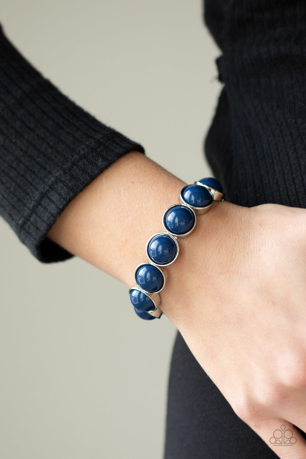 Pop, Drop and Roll - Blue Bracelets featuring depthless blue beaded centers, bubbly silver frames are threaded along stretchy bands around the wrist for a powerful pop of color.  Sold as one individual bracelet.  Paparazzi Jewelry is lead and nickel free so it's perfect for sensitive too!
