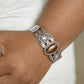 Paparazzi Accessories Solar Solstice - Brown Cuff Bracelets an oval Tiger's eye stone is pressed into the center of a studded silver frame atop an airy silver cuff embellished in studded sun-like frames for an earthy pop of seasonal color around the wrist.
