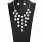 Spotlight Stunner - White Rhinestone Blockbuster Necklaces encased in sleek silver fittings, dramatically oversized white rhinestones delicately link into twinkly tassels that taper off into a jaw-dropping fringe below the collar. Features an adjustable clasp closure.  Sold as one individual necklace. Includes one pair of matching earrings.  Paparazzi Jewelry is lead and nickel free so it's perfect for sensitive skin too!