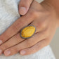 Paparazzi Accessories Stone Samba - Yellow Rings a smooth yellow stone is pressed into a studded silver frame with asymmetrical borders. Features a stretchy band for a flexible fit.  Sold as one individual ring.