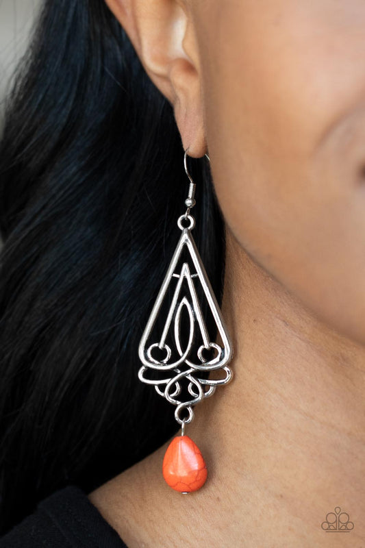 Transcendent Trendsetter - Orange Earrings a refreshing orange teardrop stone swings from the bottom of an ornate triangular frame, creating a seasonal statement. Earring attaches to a standard fishhook fitting.  Sold as one pair of earrings.  Paparazzi Jewelry is lead and nickel free so it's perfect for sensitive skin too!