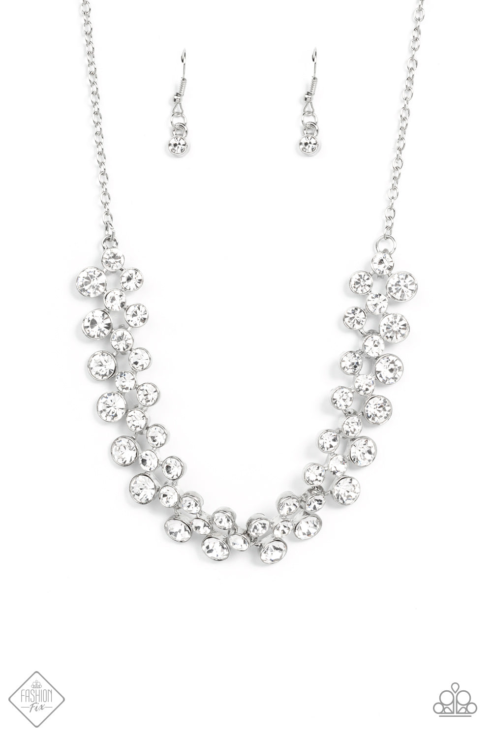 Won the Lottery - White Rhinestone Necklaces layers of brilliant white rhinestones in graduating sizes are encased in simple silver frames as they fall from a classic silver chain and delicately link across the collar, creating a dramatic display of swoon-worthy sparkle. Features an adjustable clasp closure.  Sold as one individual necklace. Includes one pair of matching earrings.