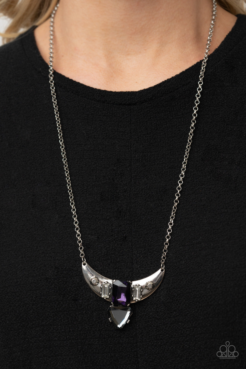 You the TALISMAN! - Purple Necklaces pairs of faceted silver beads and glassy white emerald cut gems flank an oversized emerald cut purple gem atop an antiqued silver half moon frame. A smoky triangular cut gem adorns the bottom of the pendant, creating a twinkly talisman at the bottom of a classic silver chain. Features an adjustable clasp closure. Includes one pair of matching earrings.  Paparazzi Jewelry is lead and nickel free so it's perfect for sensitive skin too!