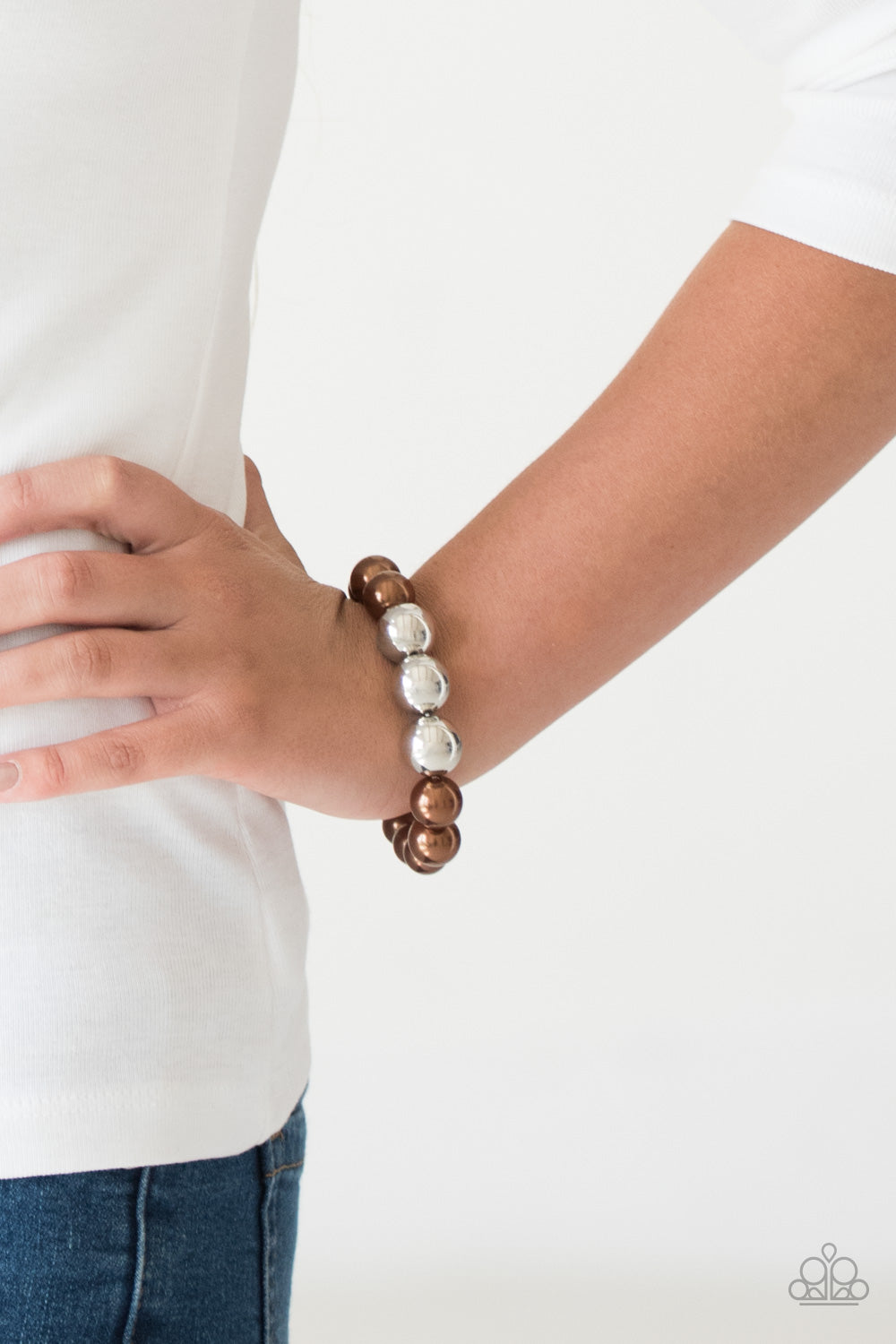Paparazzi Accessories All Dressed UPTOWN - Brown Bracelets gradually increased in size near the center, oversized pearly brown and shiny silver beads are threaded along a stretchy band around the wrist for a glamorous finish.