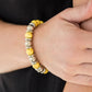 Paparazzi Accessories Across the Mesa - Yellow Bracelets a collection of silver accents and sunny yellow stones are threaded along a stretchy band for a seasonal look. Sold as one individual bracelet.