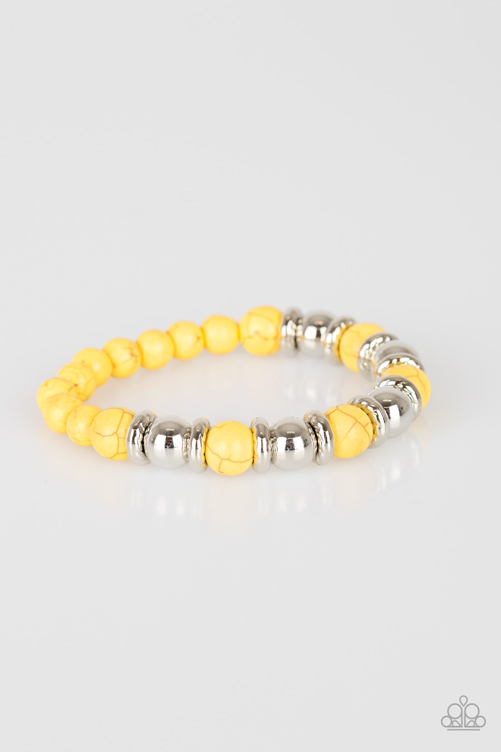 Paparazzi Accessories Across the Mesa - Yellow Bracelets a collection of silver accents and sunny yellow stones are threaded along a stretchy band for a seasonal look. Sold as one individual bracelet.