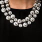 Paparazzi Accessories The Natasha - 2019 Zi Collection Necklace two rows of dramatically oversized rhinestones sparkle blindingly along the collar. The alternating sizes of the gems give this showstopper some exaggerated depth and dazzle. Features an adjustable clasp closure.  Named after 2019 Rock the Runway winner, Natasha C.  Sold as one individual necklace. Includes one pair of matching earrings.